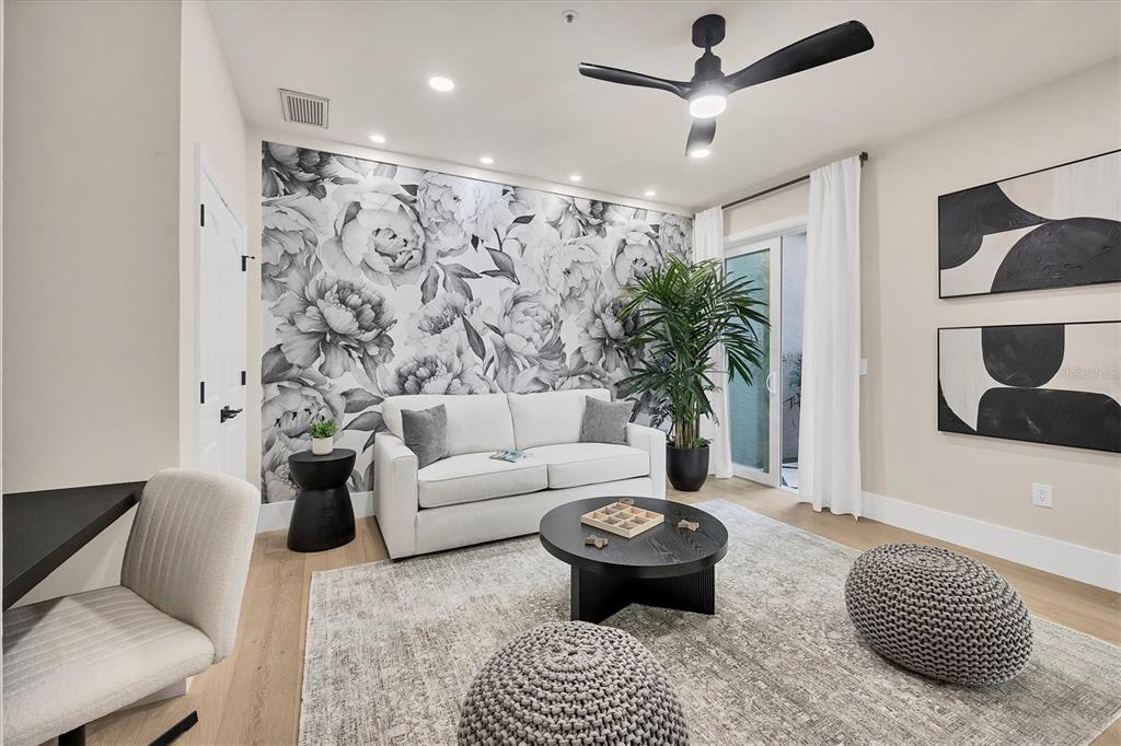 3540 Mistletoe Lane Longboat Key, FL 34228 - Photo 19 of 80 a living room with furniture or couch and a potted plant