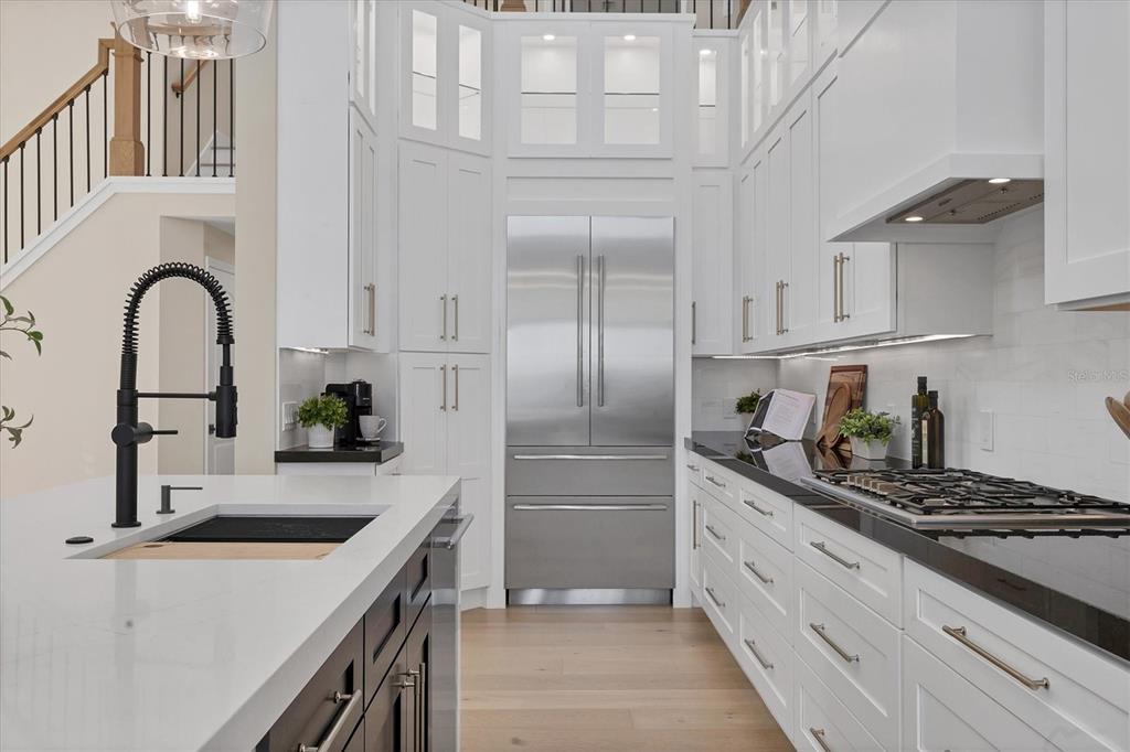 3540 Mistletoe Lane Longboat Key, FL 34228 - Photo 20 of 80 a kitchen with stainless steel appliances granite countertop a sink stove and refrigerator