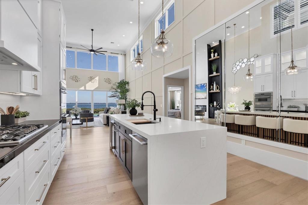 3540 Mistletoe Lane Longboat Key, FL 34228 - Photo 21 of 80 a large kitchen with stainless steel appliances lots of counter space and a sink