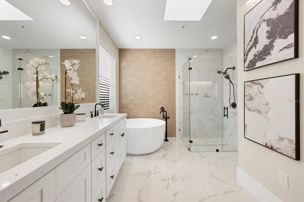 3540 Mistletoe Lane Longboat Key, FL 34228 - Photo 33 of 80 a spacious bathroom with a double vanity sink mirror double and shower