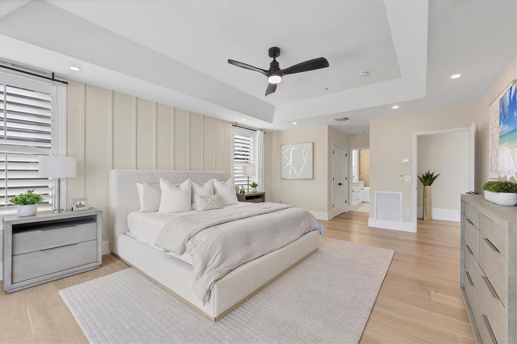 3540 Mistletoe Lane Longboat Key, FL 34228 - Photo 34 of 80 a spacious bedroom with a large bed and a chandelier