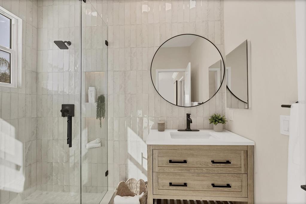 3540 Mistletoe Lane Longboat Key, FL 34228 - Photo 37 of 80 a bathroom with a sink vanity and a mirror