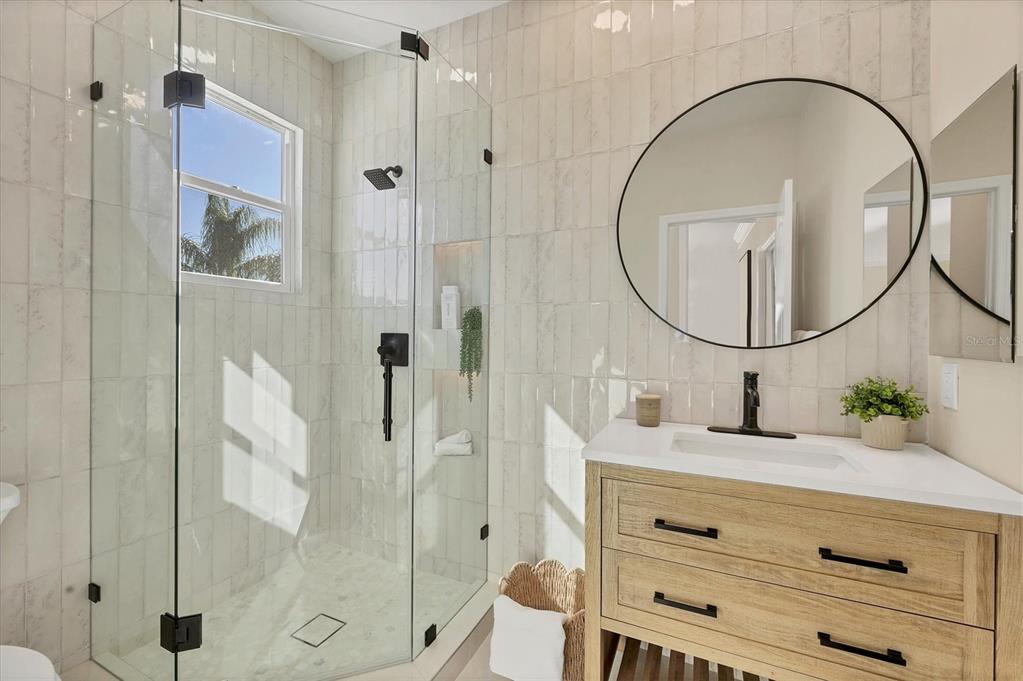 3540 Mistletoe Lane Longboat Key, FL 34228 - Photo 38 of 80 a bathroom with a sink and a mirror