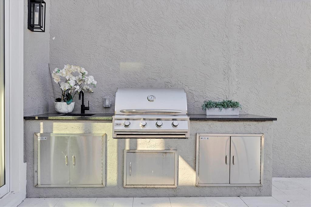 3540 Mistletoe Lane Longboat Key, FL 34228 - Photo 40 of 80 a kitchen with a stove and cabinets