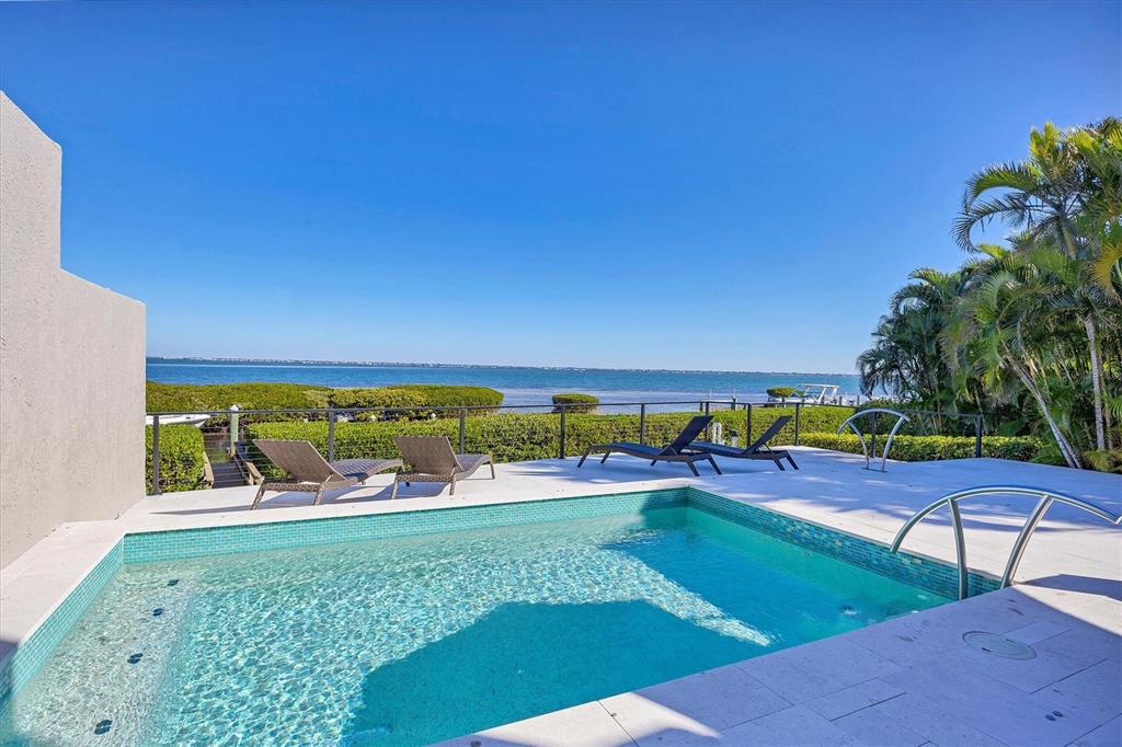 3540 Mistletoe Lane Longboat Key, FL 34228 - Photo 4 of 80 a view of swimming pool with outdoor space and seating area