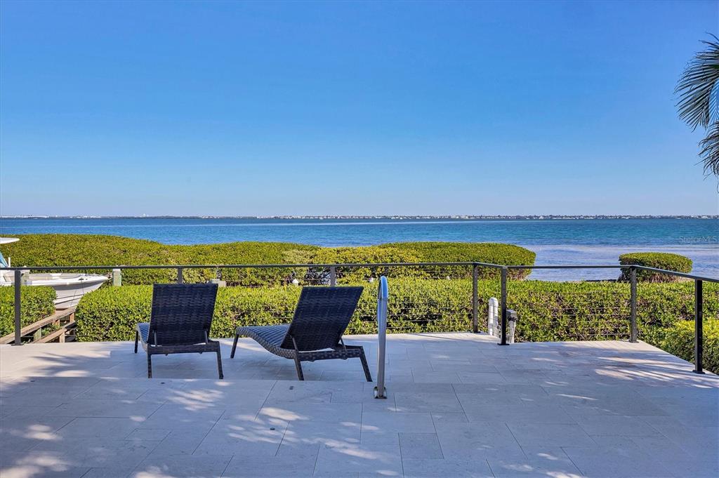 3540 Mistletoe Lane Longboat Key, FL 34228 - Photo 51 of 80 a view of a chairs and table in the patio