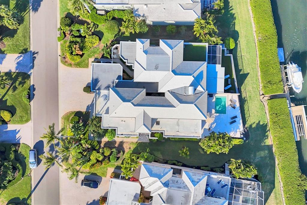 3540 Mistletoe Lane Longboat Key, FL 34228 - Photo 59 of 80 an aerial view of a house with a yard basket ball court and outdoor seating