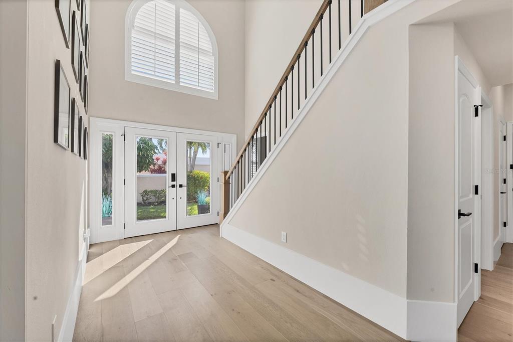 3540 Mistletoe Lane Longboat Key, FL 34228 - Photo 9 of 80 a view of an entryway with staircase