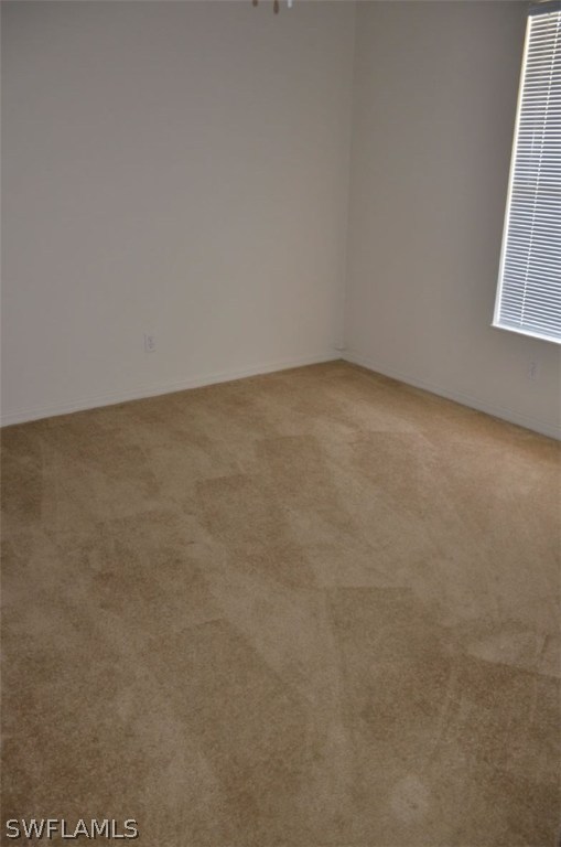 3821 Sunset Road Lehigh Acres, FL 33971 - Photo 14 of 20 a view of an empty room and a window