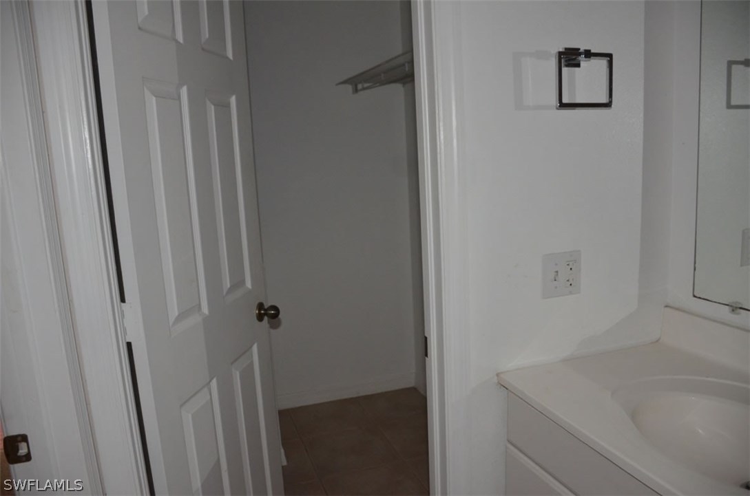 3821 Sunset Road Lehigh Acres, FL 33971 - Photo 19 of 20 a bathroom with a sink and a bathtub