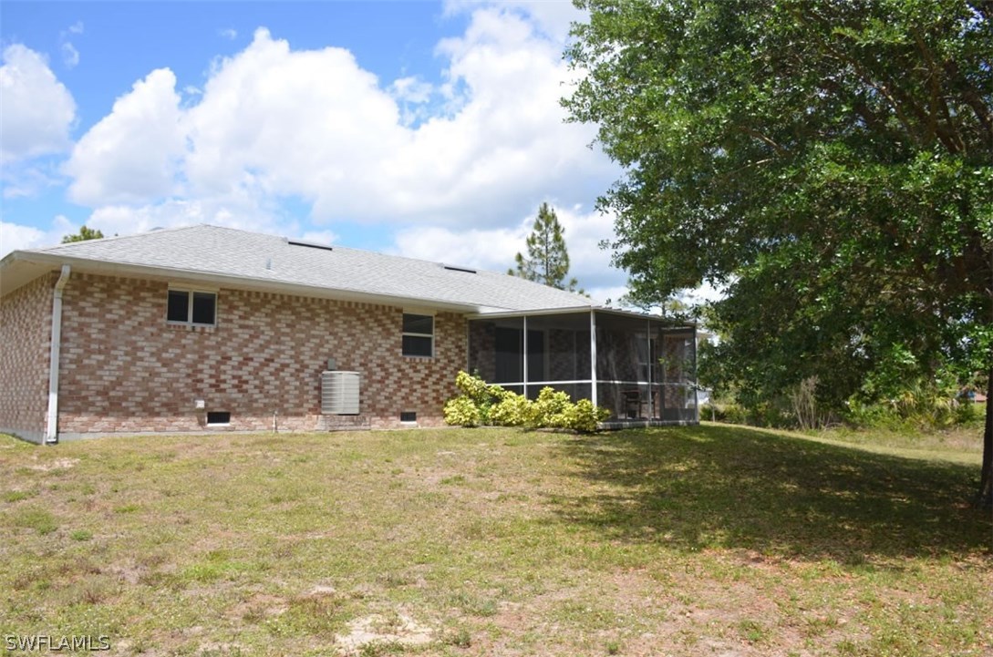 3821 Sunset Road Lehigh Acres, FL 33971 - Photo 3 of 20 a view of a house with yard and front view of a house