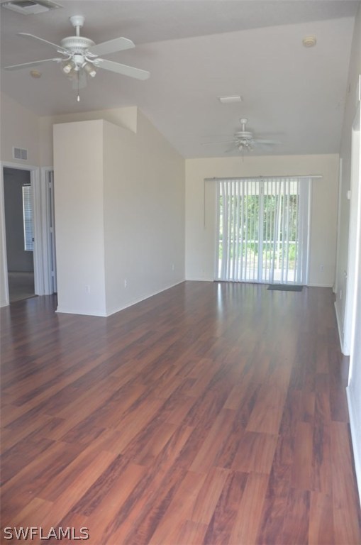 3821 Sunset Road Lehigh Acres, FL 33971 - Photo 4 of 20 a view of an empty room with wooden floor and a window