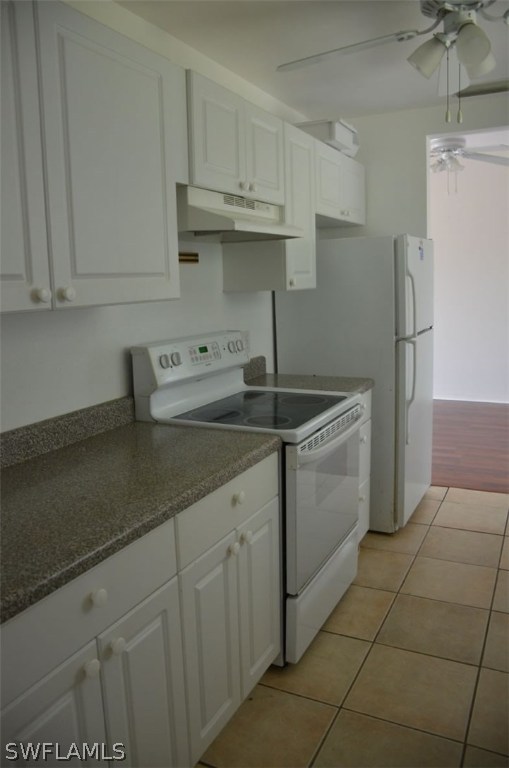 3821 Sunset Road Lehigh Acres, FL 33971 - Photo 8 of 20 a kitchen with stainless steel appliances granite countertop a sink stove and refrigerator