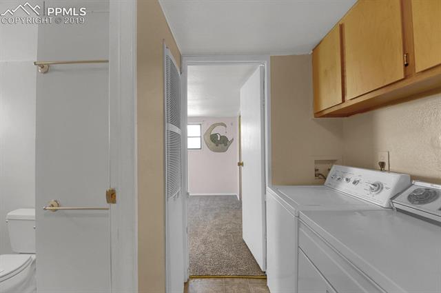 5645 Good Fortune Road Peyton, CO 80831 - Photo 14 of 23 Laundry space with full bath across the hall.
