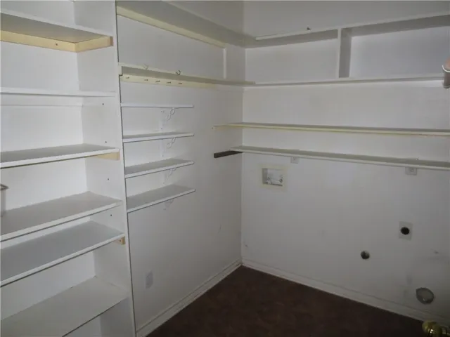 a view of an empty walk in closet