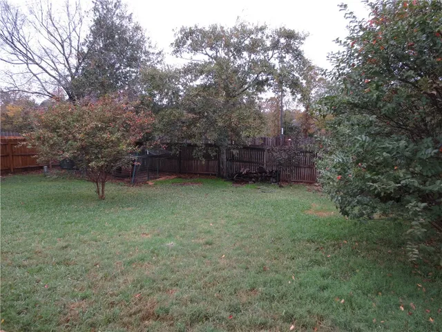 a view of a backyard with a garden
