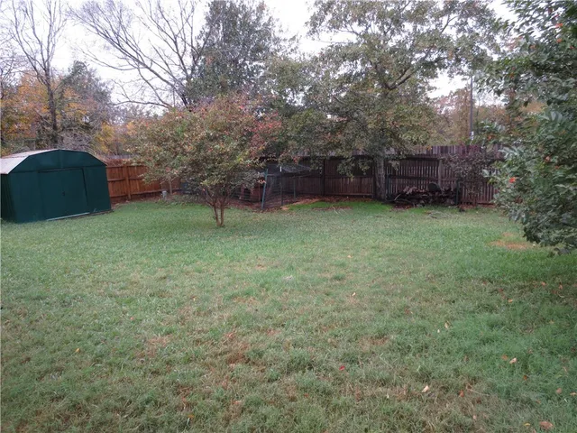 a backyard of a house with lots of green space