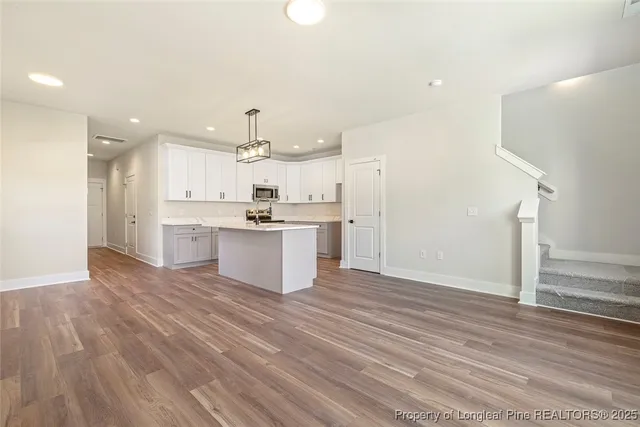 a view of kitchen with wooden floor