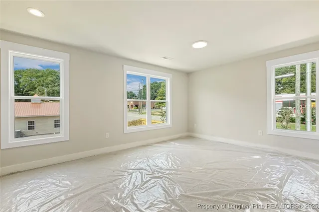 a view of an empty room with a window