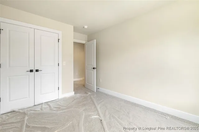 a bathroom with a sink toilet double vanity and mirror