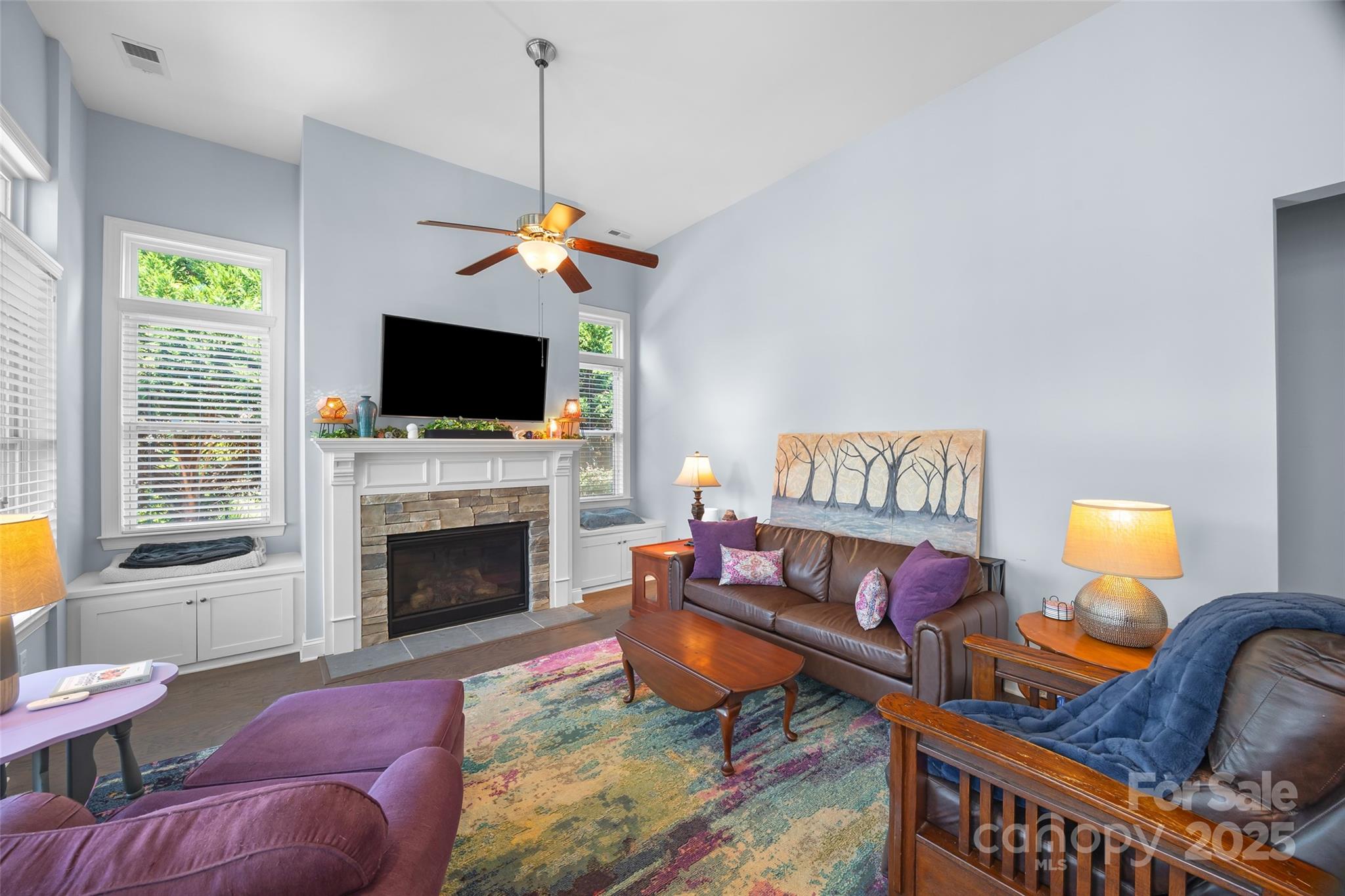 5212 Meadowcroft Way Fort Mill, SC 29708 - Photo 14 of 43 a living room with furniture a flat screen tv and a fireplace
