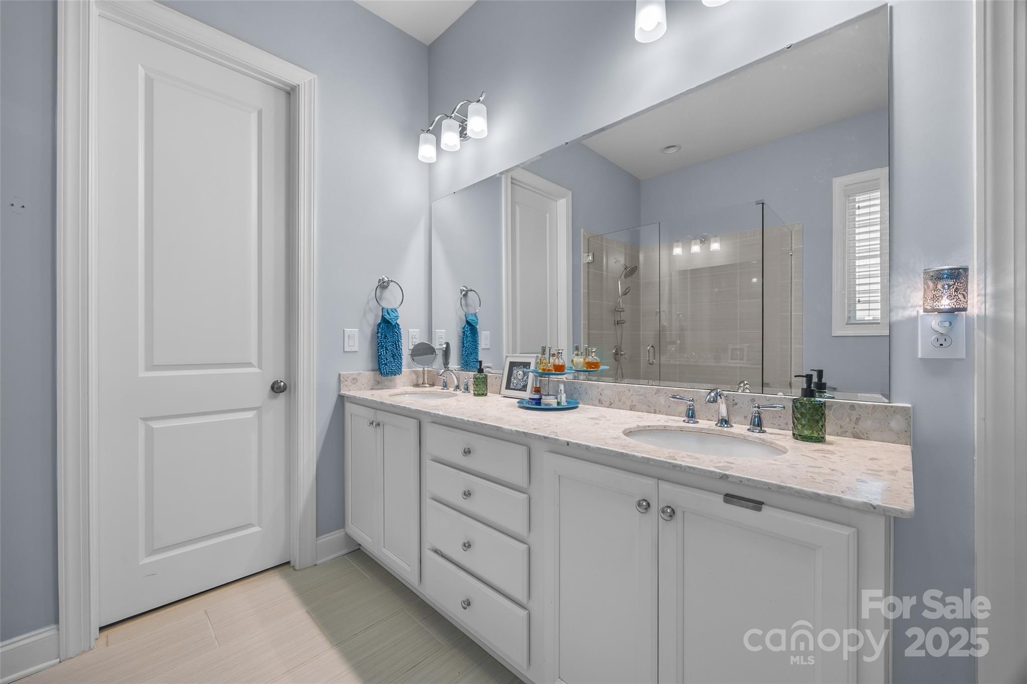 5212 Meadowcroft Way Fort Mill, SC 29708 - Photo 19 of 43 a bathroom with double sink and a mirror