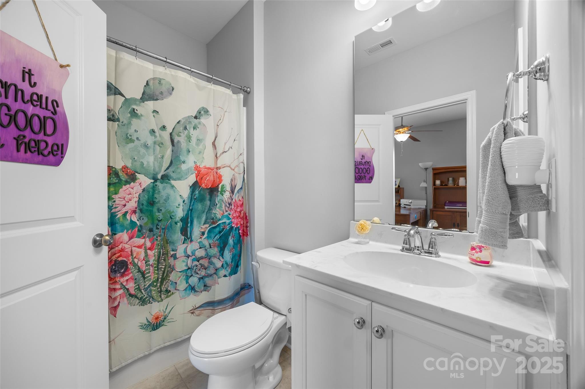 5212 Meadowcroft Way Fort Mill, SC 29708 - Photo 28 of 43 a bathroom with a toilet sink and mirror