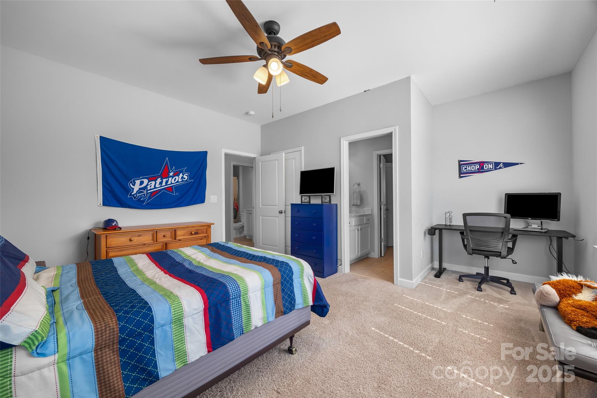 5212 Meadowcroft Way Fort Mill, SC 29708 - Photo 30 of 43 a bedroom with a bed and a chandelier