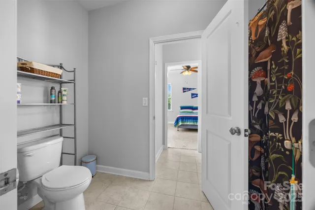 a bathroom with a sink vanity mirror and a shower