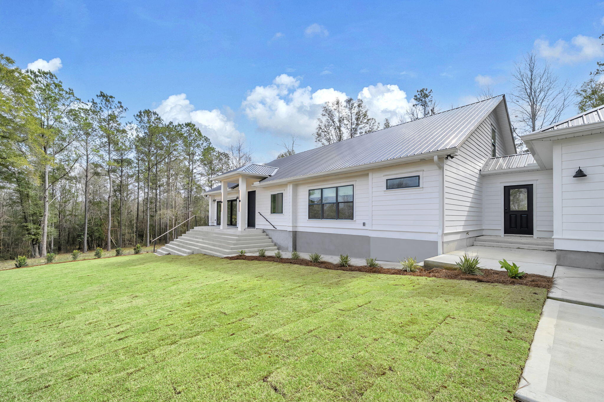 1388 Pusley Hill Road Ponce de Leon, FL 32455 - Photo 10 of 16 a front view of a house with a yard and garage