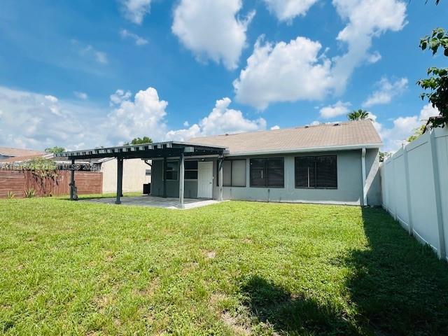 Rainberry Park Boca Raton, FL 33428 - Photo 15 of 17 a view of a house with backyard and garden