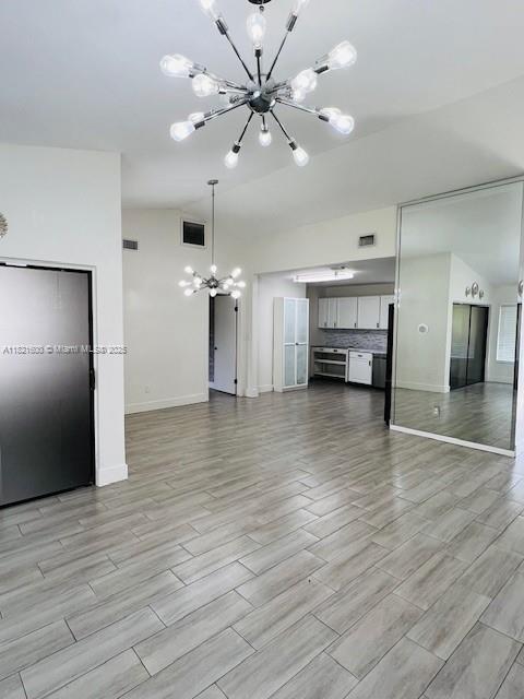 Rainberry Park Boca Raton, FL 33428 - Photo 4 of 17 a view of an empty room with kitchen and a window