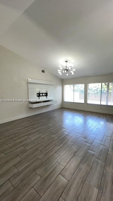 Rainberry Park Boca Raton, FL 33428 - Photo 6 of 17 wooden floor in an empty room with a window