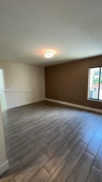 Rainberry Park Boca Raton, FL 33428 - Photo 9 of 17 an empty room with wooden floor and windows