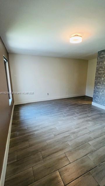 Rainberry Park Boca Raton, FL 33428 - Photo 10 of 17 an empty room with wooden floor and windows