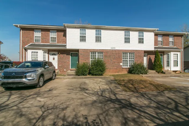 a view of a car parked in front of a house