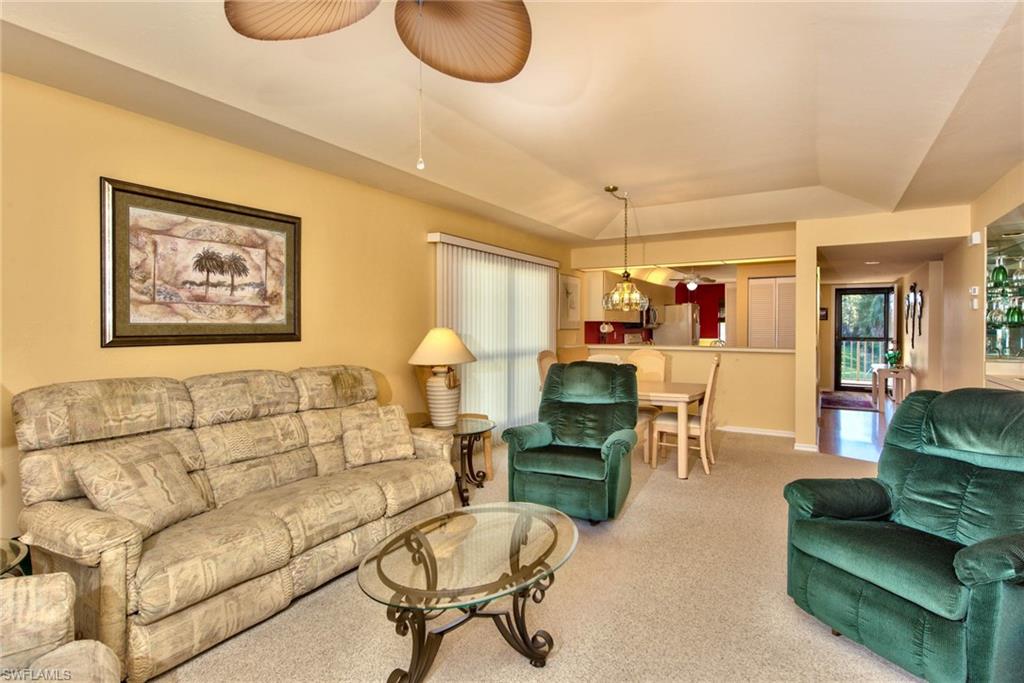 4410 Chantelle Drive, Unit H206 Naples, FL 34112 - Photo 12 of 25 a living room with furniture kitchen view and a window