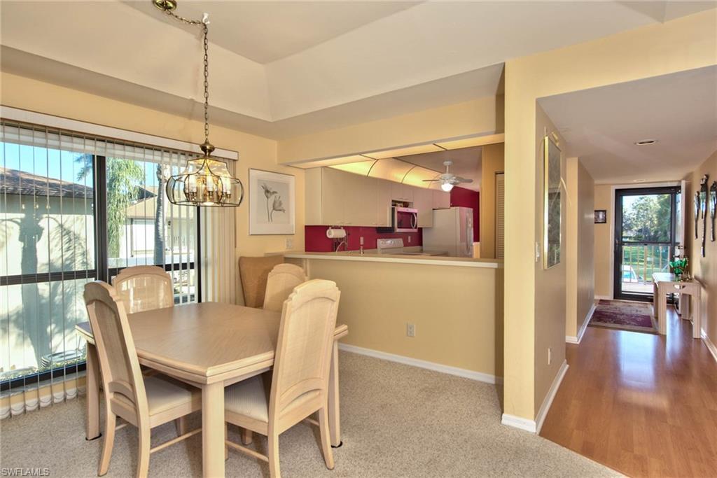 4410 Chantelle Drive, Unit H206 Naples, FL 34112 - Photo 13 of 25 a dining room with furniture and window