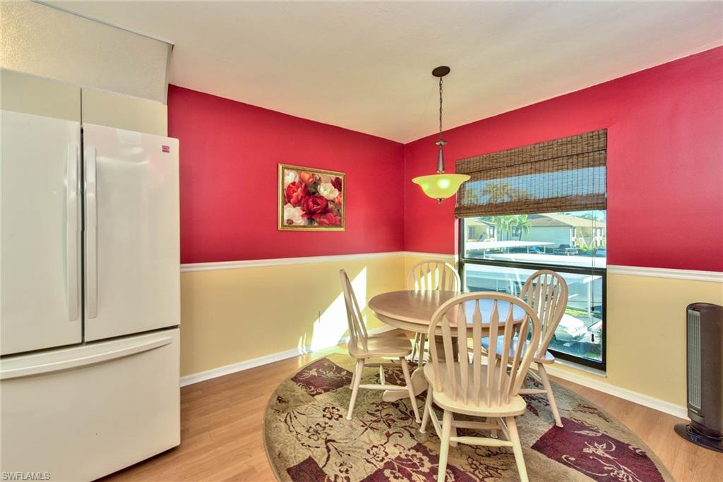 4410 Chantelle Drive, Unit H206 Naples, FL 34112 - Photo 17 of 25 a view of a dining room with furniture window and outside view