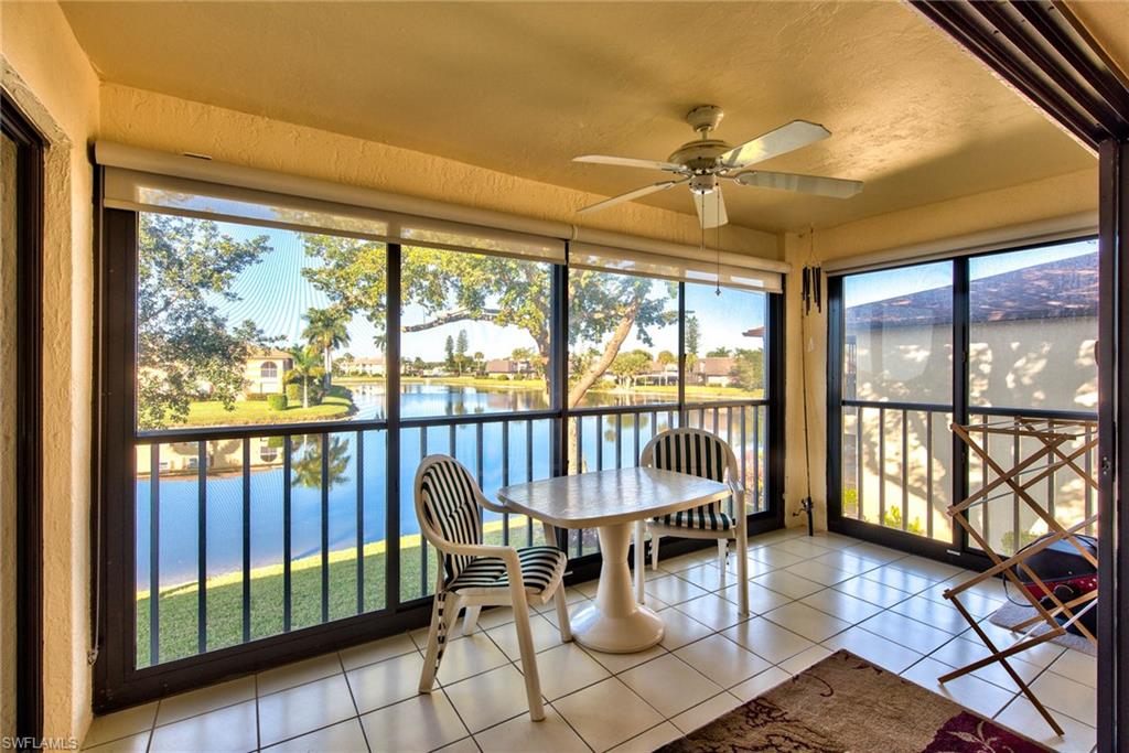 4410 Chantelle Drive, Unit H206 Naples, FL 34112 - Photo 2 of 25 a view of a dining room with furniture water view and wooden floor