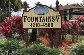 4410 Chantelle Drive, Unit H206 Naples, FL 34112 - Photo 25 of 25 a sign broad in front of the red brick house