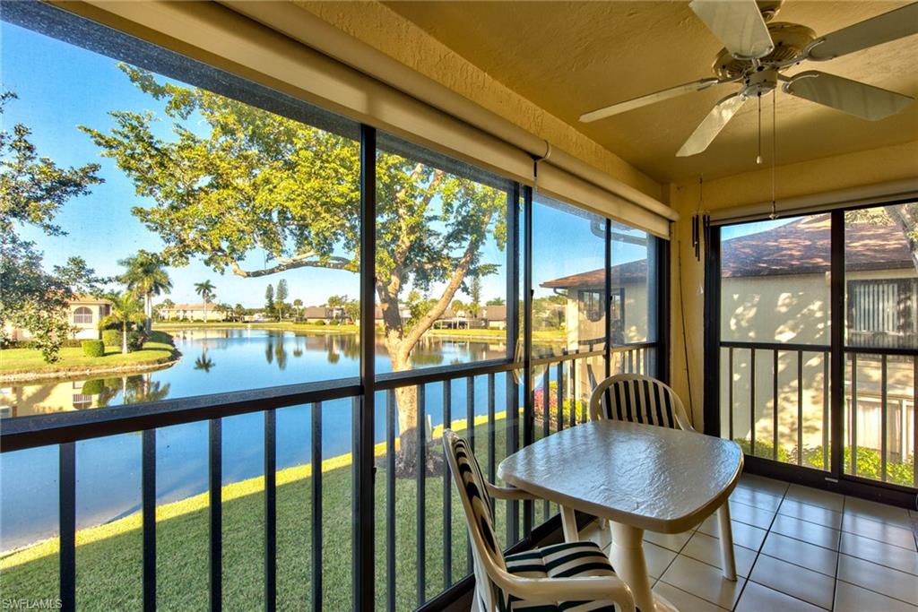 4410 Chantelle Drive, Unit H206 Naples, FL 34112 - Photo 4 of 25 a view of a balcony with furniture and wooden floor