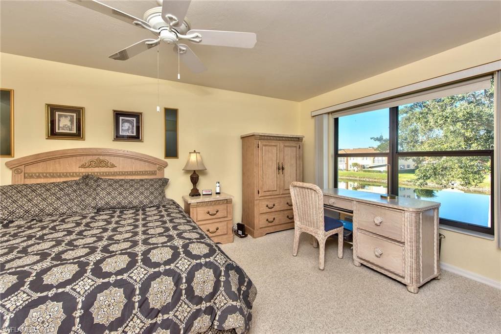 4410 Chantelle Drive, Unit H206 Naples, FL 34112 - Photo 5 of 25 a bedroom with a bed and a window
