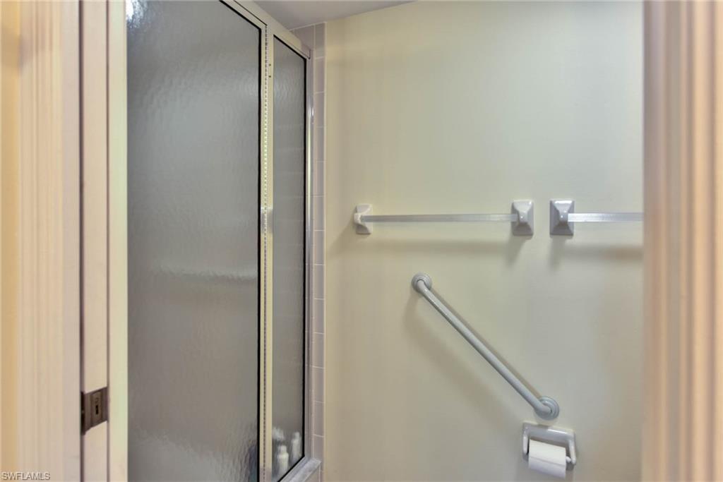 4410 Chantelle Drive, Unit H206 Naples, FL 34112 - Photo 9 of 25 a close view of cabinet in kitchen