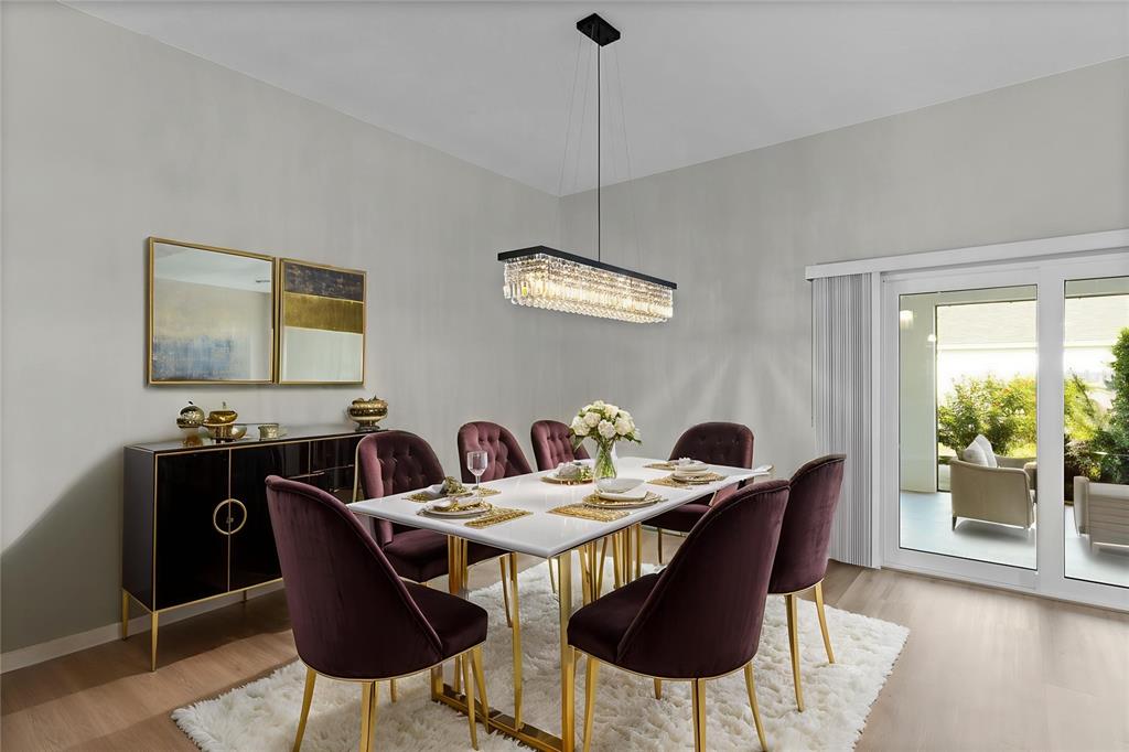 1177 Elkington Road The Villages, FL 34762 - Photo 13 of 59 a view of a dining room with furniture window and wooden floor