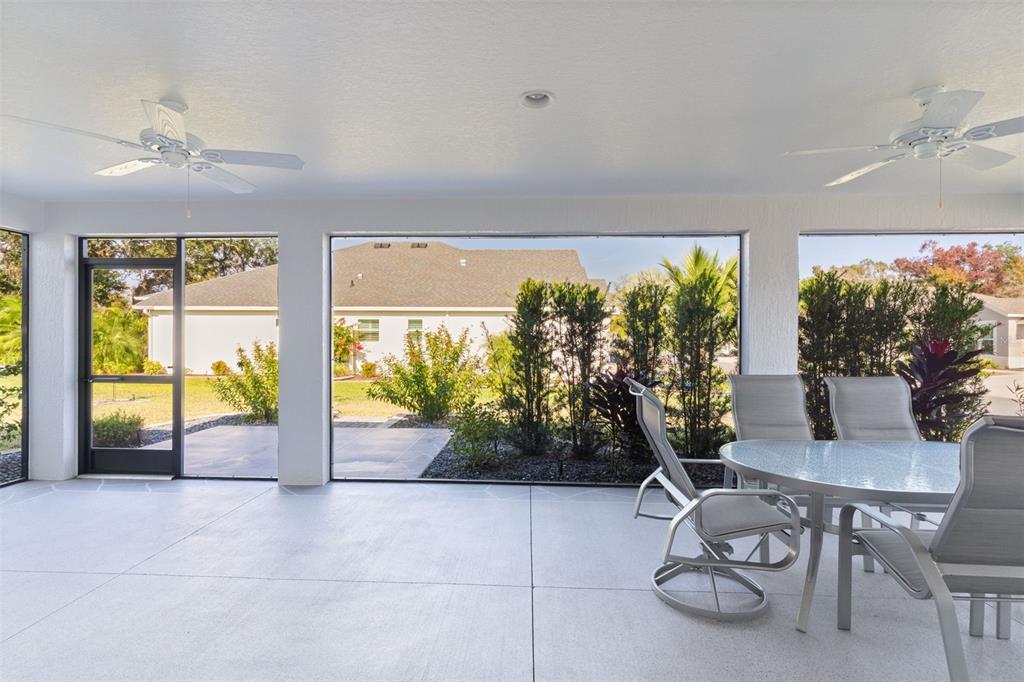 1177 Elkington Road The Villages, FL 34762 - Photo 34 of 59 a living room with furniture and a large window