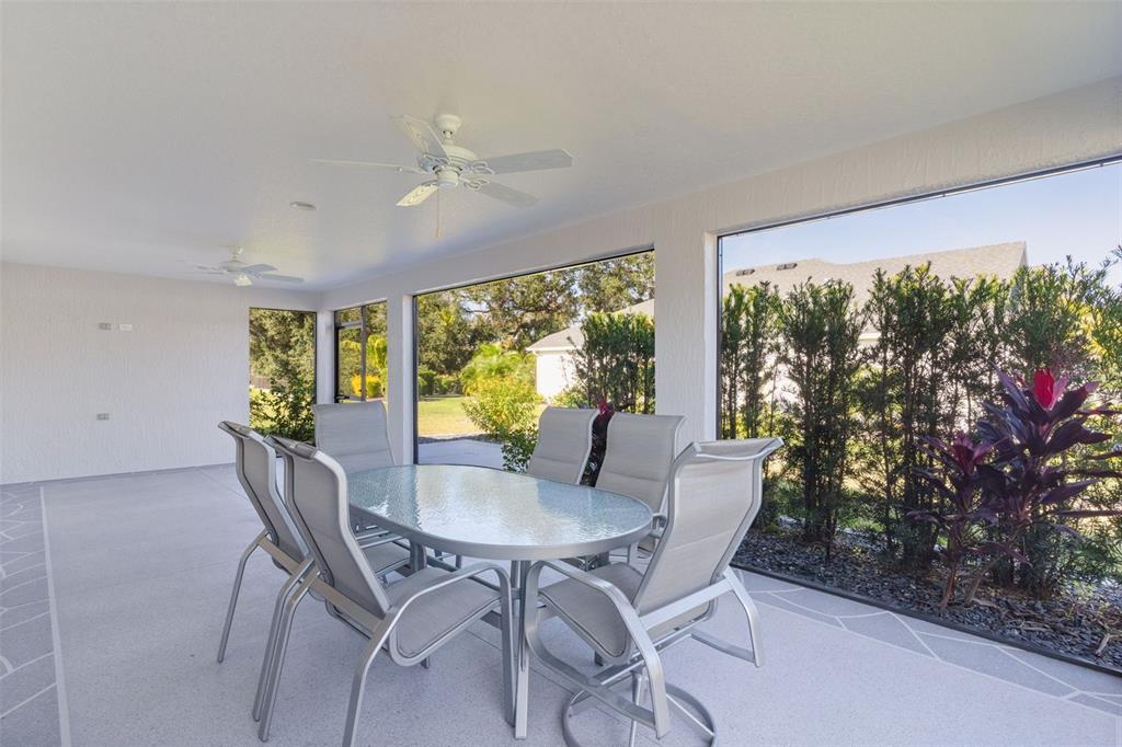 1177 Elkington Road The Villages, FL 34762 - Photo 35 of 59 a view of a dining room with furniture window and outside view