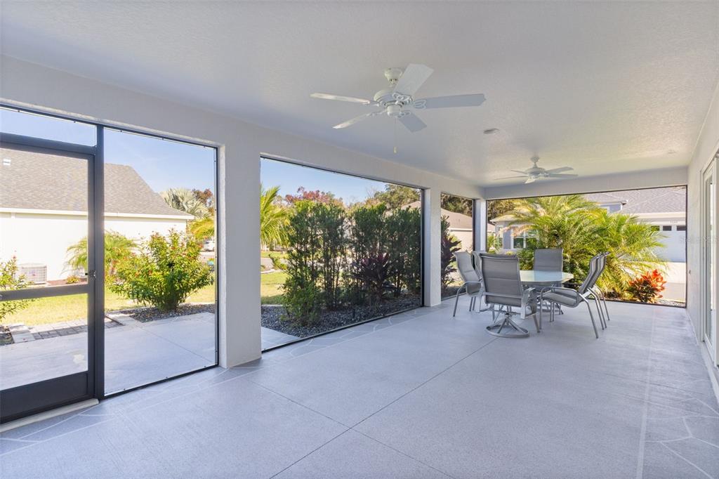 1177 Elkington Road The Villages, FL 34762 - Photo 38 of 59 a living room with furniture and a large window