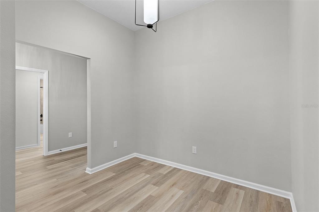 1177 Elkington Road The Villages, FL 34762 - Photo 41 of 59 a view of an empty room with wooden floor