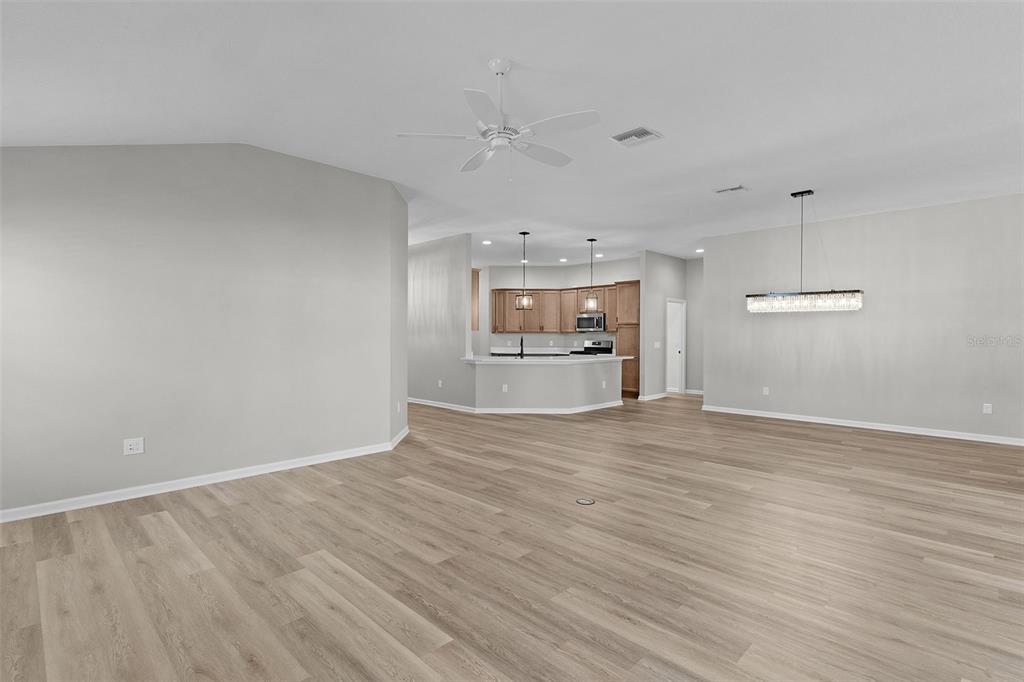 1177 Elkington Road The Villages, FL 34762 - Photo 42 of 59 a view of empty room with wooden floor